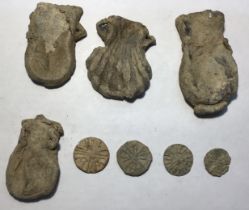 Four Medieval Pilgrims Ampulla and Tokens .  Circa 14th-15th century AD. Lead. The Ampullae were '