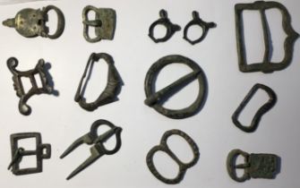 Collection of Medieval buckles some with evidence of gilding.