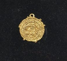 Saxon/Merovingian Gold pendant of Gold Twisted Wire Work attached to a disc of gold with