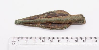 Incomplete Late Bronze Age copper alloy spearhead, the open end of the socket missing. The cutting