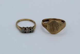 A collection of gold rings. Comprising a 9ct gold signet ring, size R; a 9ct gold three stone