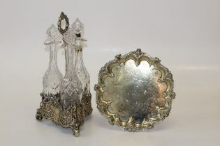 A silver plated decanter set and footed tray.