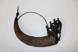 A 20th century Pacific Islands type horn flask, with carved wood figural pegged cap. 42cm wide