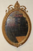 A 19th Century gilt gesso wall mirror, the beaded egg and dart moulded frame applied with stiff