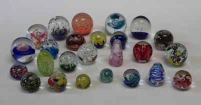 A collection of twenty five 20th century paperweights. Various, including floral, scrambled and