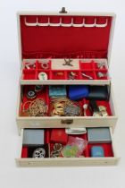 A box of contemporary and vintage costume jewellery.