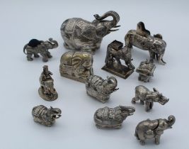 A collection of Indian silver and other white metal elephant boxes and covers, the largest 12cm