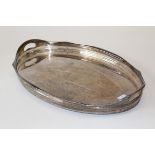 A silver plated oval tray of large size, having an undulated pierced raised side, width 62cm