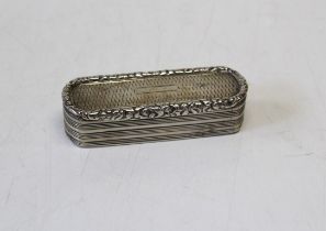 An early Victorian silver oblong snuff box having engine turned decoration and rounded ends, the