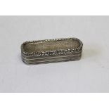An early Victorian silver oblong snuff box having engine turned decoration and rounded ends, the