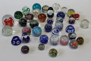 A collection of thirty six 20th century paperweights. Various, including facet cut, bubble and