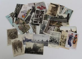 A small collection of approximately eighty early 20th century and later postcards. Including the