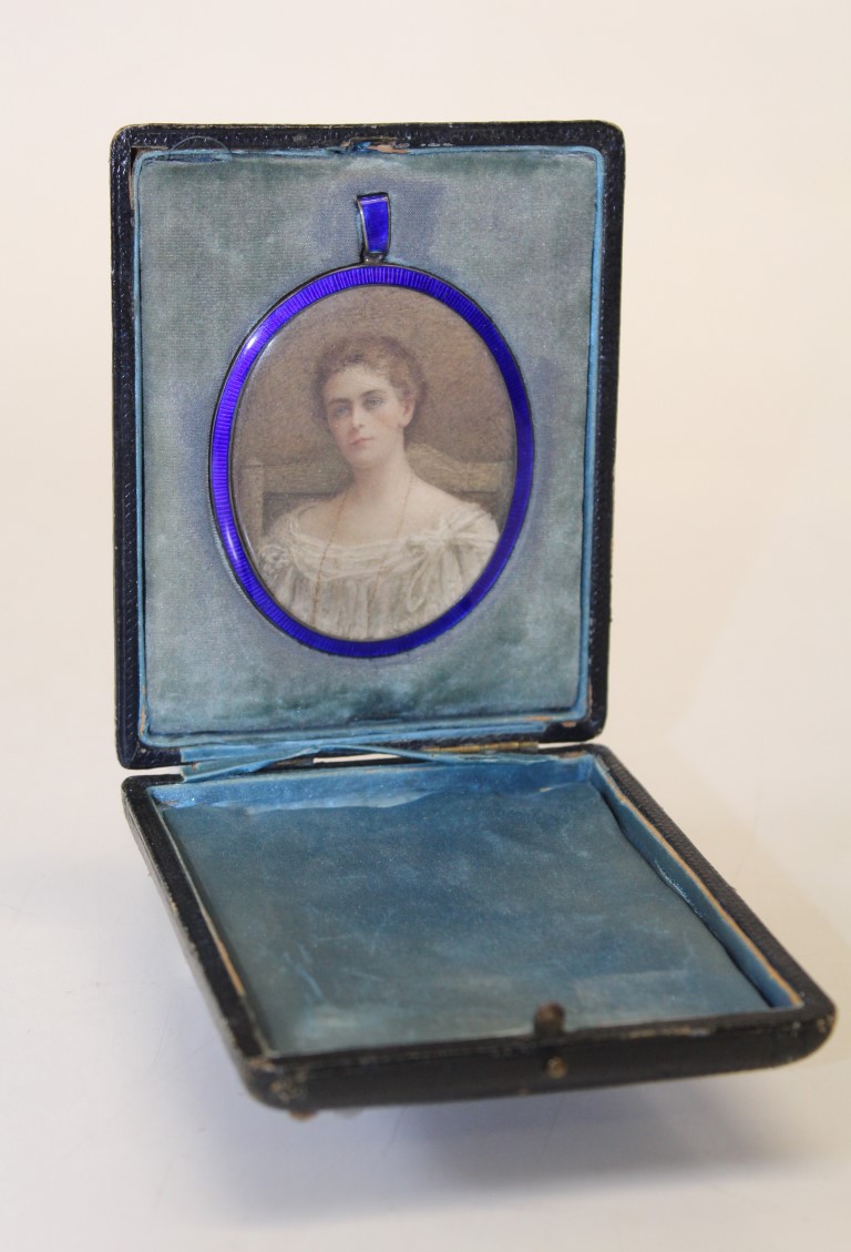 Edwardian English School, bust length portrait miniature of a young woman wearing a lace trimmed