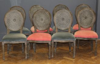 A set of eight Oka limed oak dining chairs, each with cameo cane back, overstuffed seat, on turned