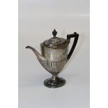 Goldsmiths and Silversmiths Co Ltd, an Edwardian silver coffee pot, of demi- reeded Neo Classical