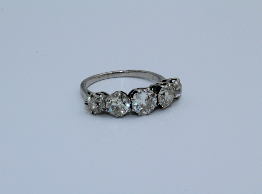 A five stone diamond ring in white metal, assessed as platinum. Set with five transitional cut - Image 2 of 3