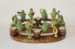 Jerome Massier - a mid 20th century majolica glazed frog chorus. 46cms wide. Signed to base.