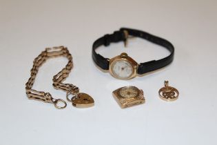 A collection of 9ct gold jewellery and other items. Comprising a 9ct gold gate bracelet with heart