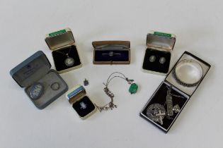 A collection of sterling silver jewellery to include a circular Celtic Cross shield, a silver