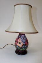 A circa 1990's Moorcroft table lamp of baluster form, decorated in Pansy pattern by Rachel Bishop,