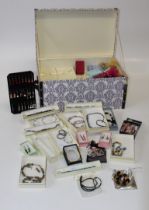 A large lot of handmade natural and synthetic gemstone jewellery, dead stock, presented in gift