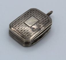 A small George III silver vinaigrette, of canted oblong form, with vacant cartouche and gilded