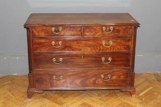 A mahogany chest of drawers, having two short and three long drawers fitted with brass handles,