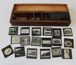 A collection of approximately seventy early 20th century magic lantern slides, subject material
