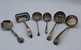 George Maudsley Jackson, a Victorian silver sifter spoon with beaded handle, London 1886, another