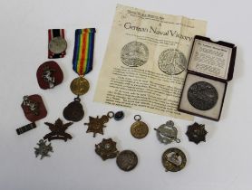 A collection of medals comprising a German 1937 medal for annexation of the Sudetenland, a 1936
