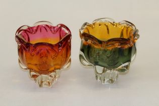 Two mid century Czechoslovakian glass footed bowls, each of organic form, amber/ cranberry and