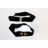 A seed pearl studded rectangular box clasp on yellow metal affixed to a velvet ribbon as a choker,