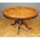 A Victorian walnut and inlaid breakfast table, the snap top raised on quadruple swept legs, width