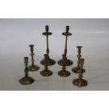 A pair of 19th century mahogany and brass mounted large candlesticks with twist and fluted