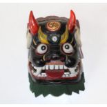 A 20th century Mahakala type painted carved wood mask. 17 x 12cm