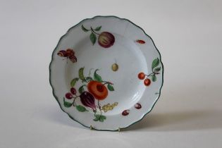 A mid 18th century Chelsea porcelain Botanical plate, polychrome decorated with butterfly,