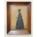 19th century English School, a full length silhouette portrait of a lady holding a letter. Cut