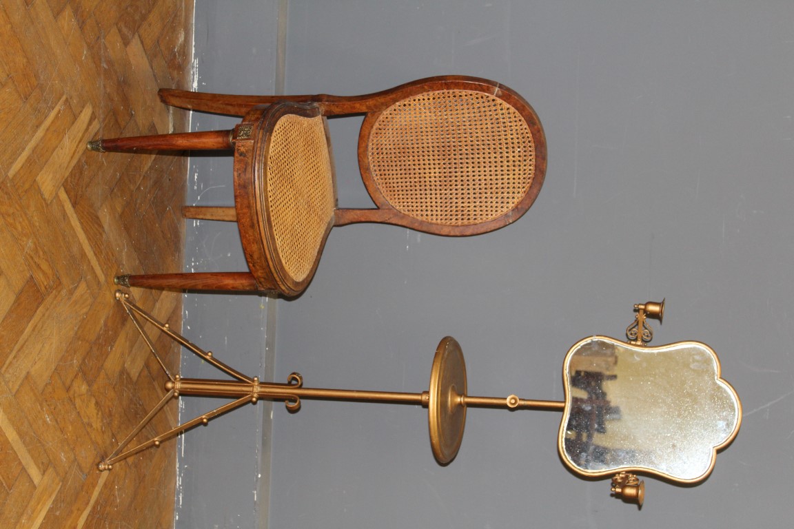 An early 20th century later gilt painted shaving stand with twin candle sconces and adjustable