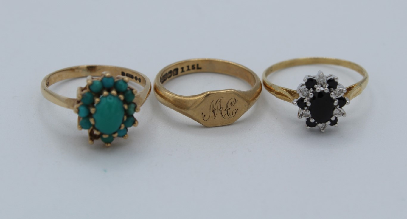 A group of three 9ct gold rings, a sapphire and cubic zirconia ring, size P, a turquoise cluster