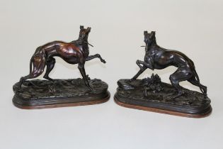 After Jules Moigniez, a pair of cast bronze patinated spelter figures of longdogs, each with