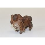 A cold painted bronze Pekingese dog, standing four square with head turned to the left. 6.5 x 9cm