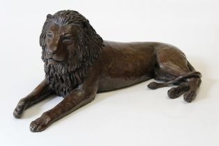 Donald Greig born 1959 South African  A cast bronze of a recumbent lion c2002, 9/12, width 71cm