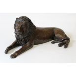 Donald Greig born 1959 South African  A cast bronze of a recumbent lion c2002, 9/12, width 71cm