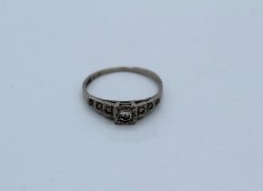 A platinum and diamond Art Deco style ring, size N. Gross weight approximately 2.52gm