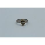 A 1/2 carat marquise cut diamond solitaire in a gold and platinum bezel mount. Size L. Gross