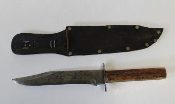 A Bowie knife with staghorn grip in leather scabbard. Total length, 34cm