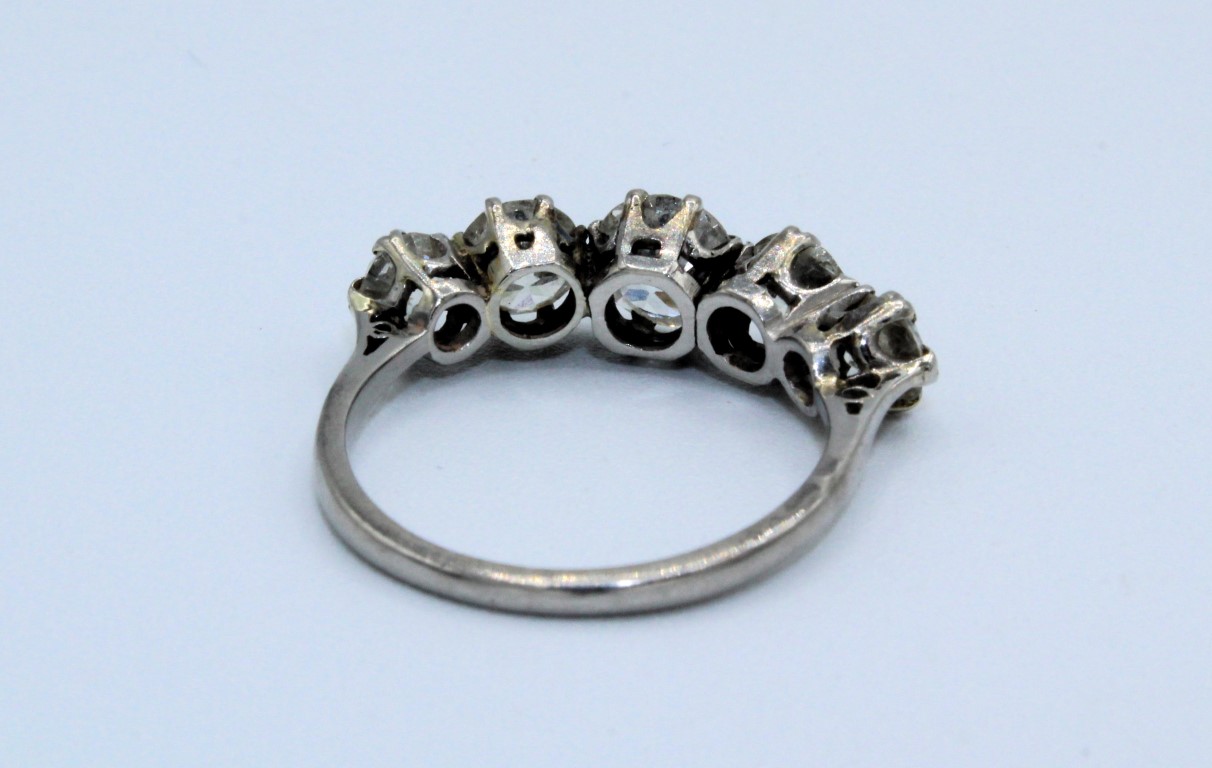 A five stone diamond ring in white metal, assessed as platinum. Set with five transitional cut - Image 3 of 3