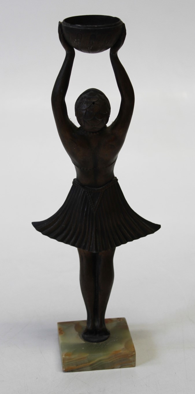 An Art Deco period cast bronze patinated spelter figure of a dancing girl holding a bowl above her - Image 2 of 2