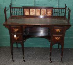 An Art Nouveau mahogany lady's writing desk, the spindle gallery top set five pre- Raphaelite