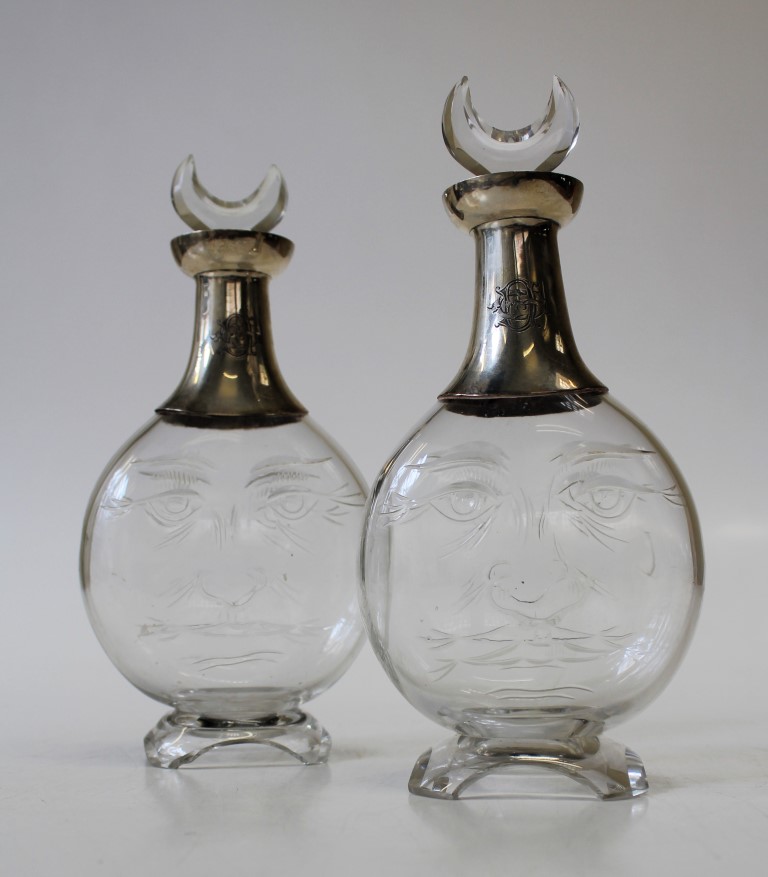 A pair of Victorian silver mounted Hukin and Heath cut glass small decanters with crescent stoppers,